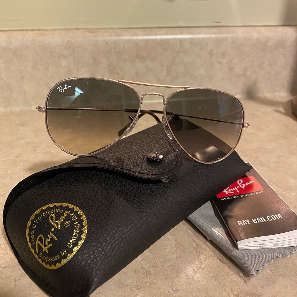 Ray ban customized aviators with bronze gold frame and brown gradient lens.